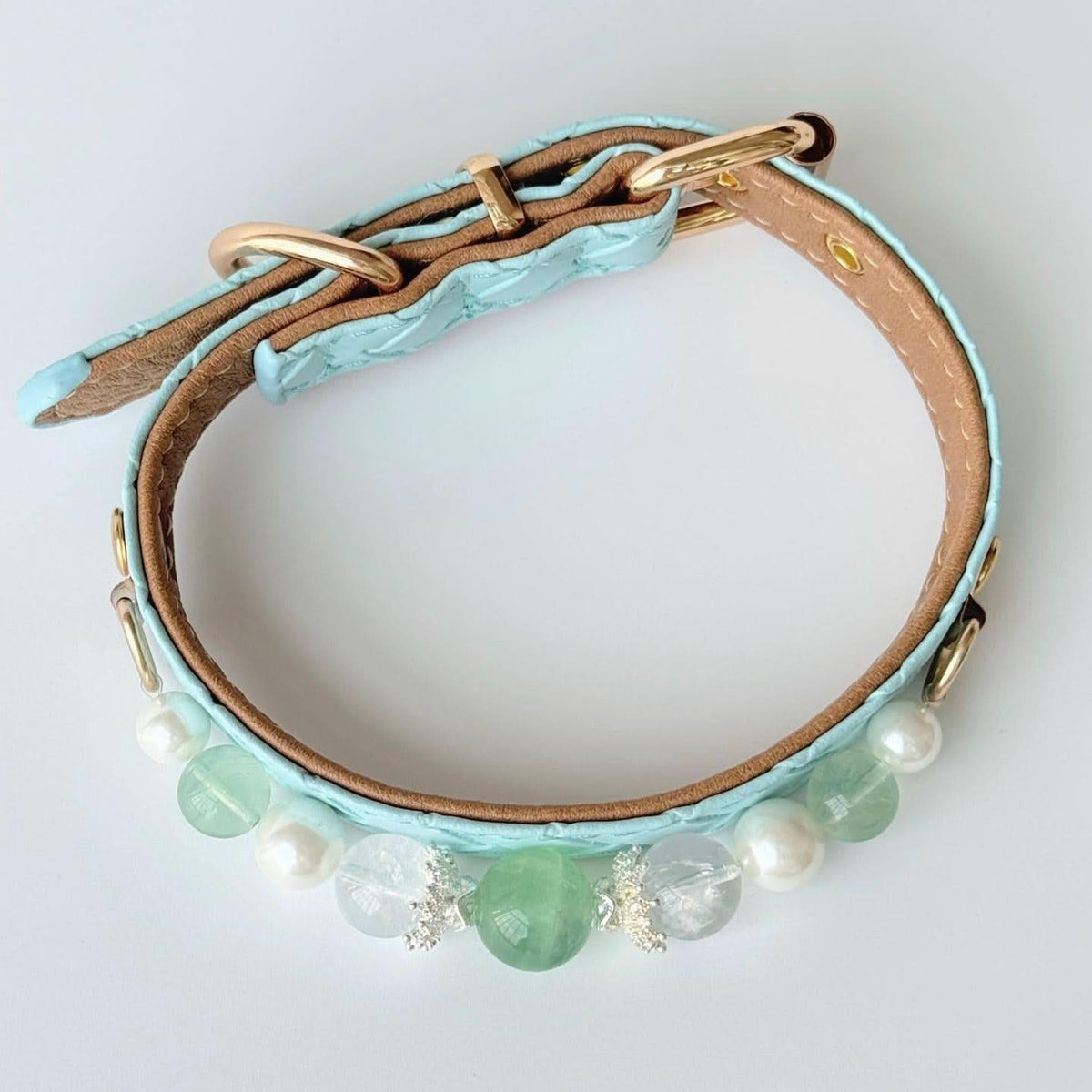 Overhead circular view of mint blue quilted pet collar with green pearl bead trim | DIY Jade