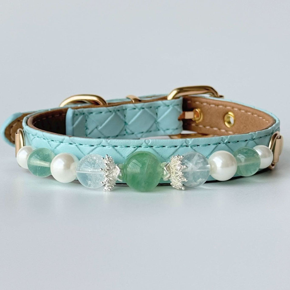 Front view mint blue quilted pet collar decorated with green gemstone and pearls | DIY Jade