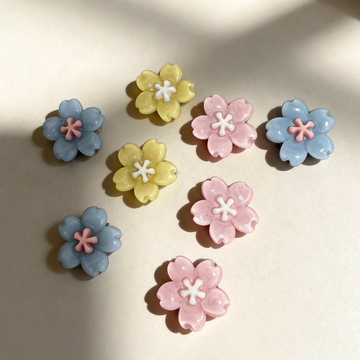 Assorted pastel flower decorative charms for small dog cat collars studio view | DIY Jade