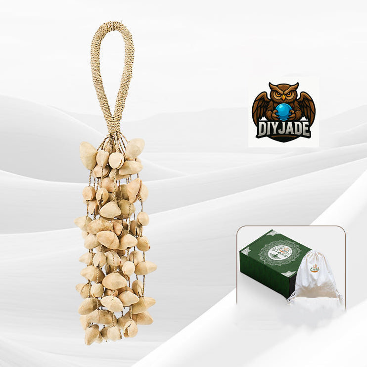 Long tassel style pale seed pod hanging ornament, grey background studio product shot | DIY Jade