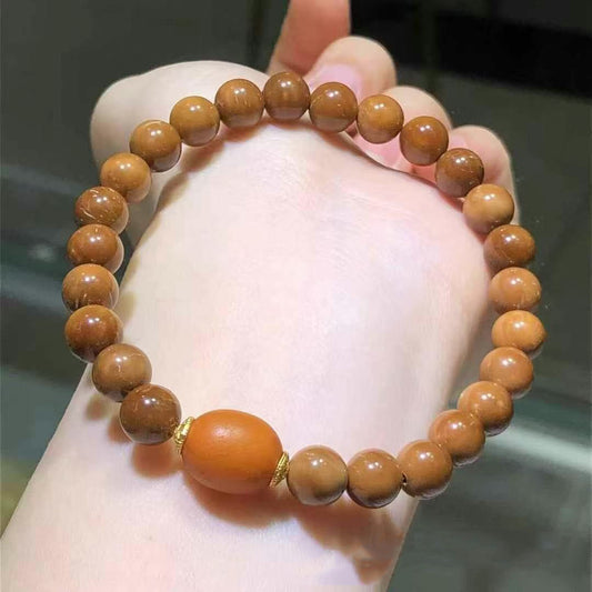 Old sandalwood round bead bracelet with vintage amber accent bead | DIY Jade

