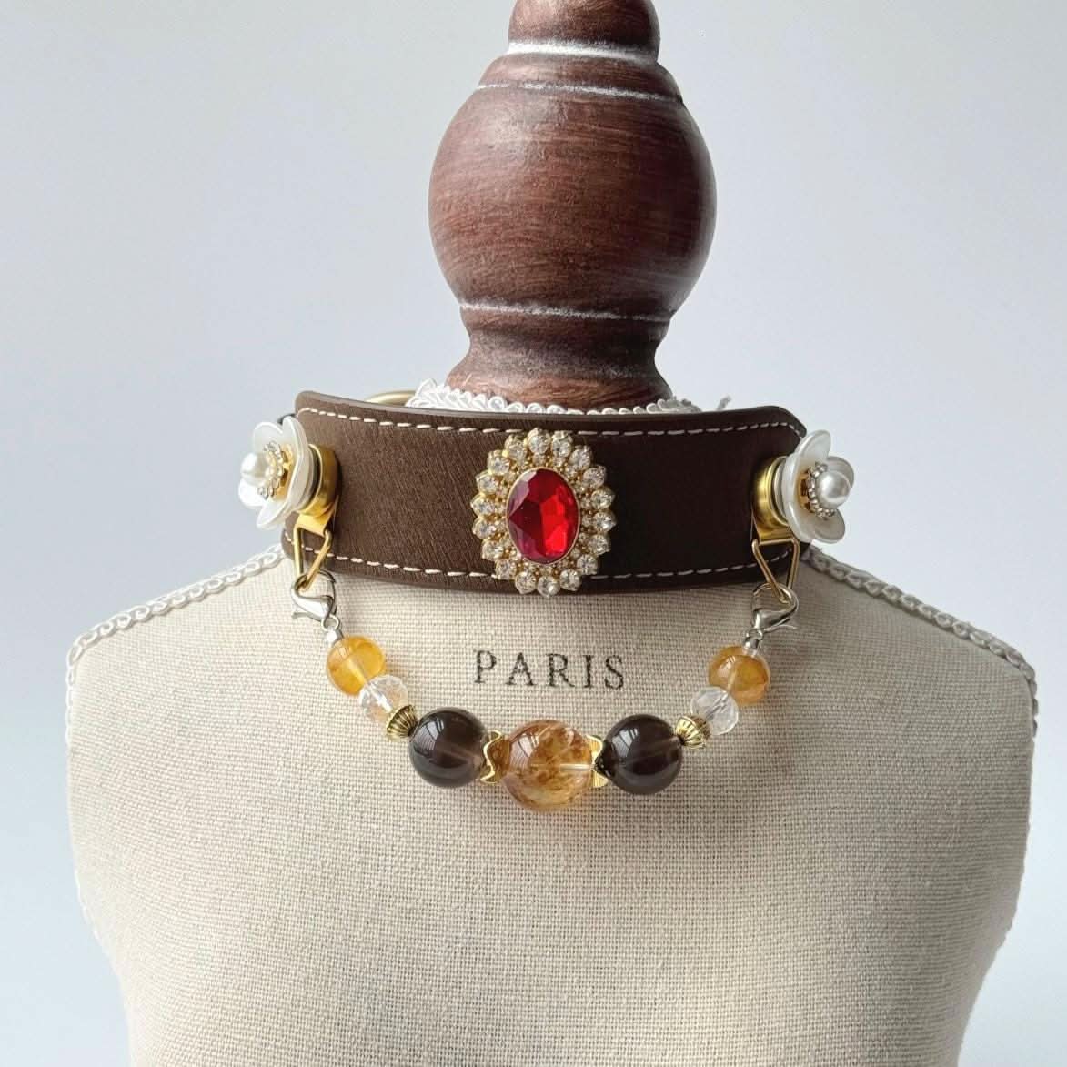 Ornate gemstone pet collar displayed on fabric mannequin for product showcase | DIY Jade
