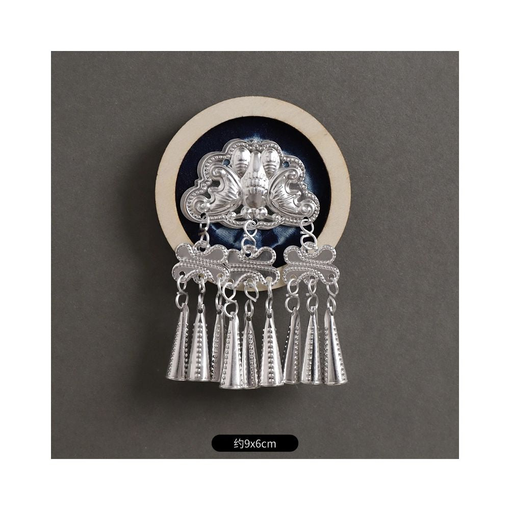 Oval ethnic silver brooch with tassels