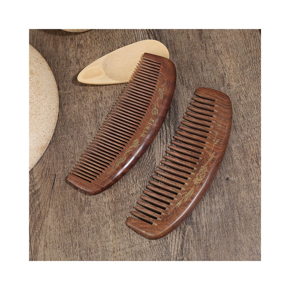 Pair of engraved wooden hair combs set