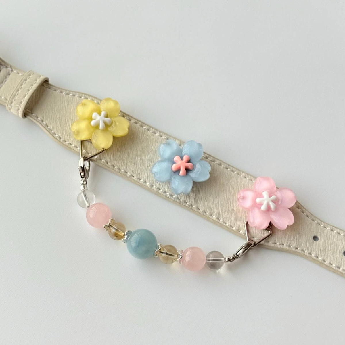 Pastel flower trio crystal pet collar flat lay showing PU leather strap, buckle and beaded chain detail | DIYJade