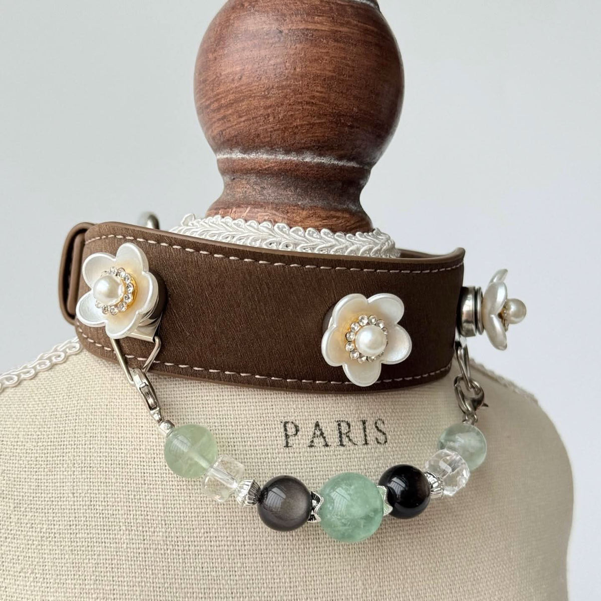 Pearl flower brown leather pet collar on mannequin bust, back view showing adjustable buckle | DIYJade