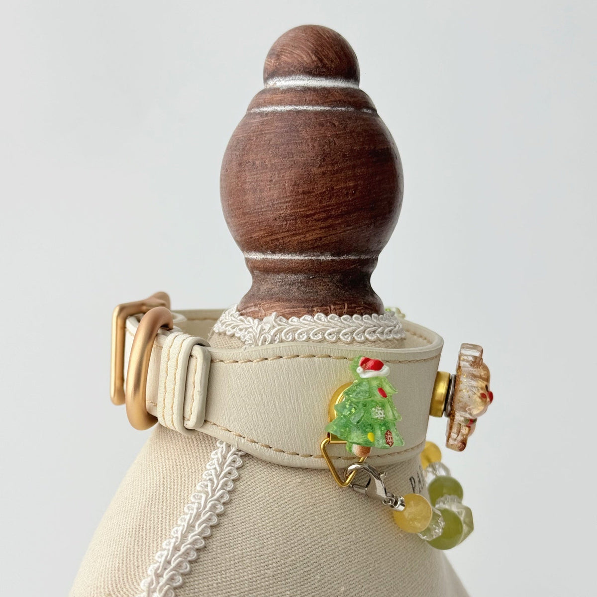 Pet collar, Cream leather Christmas pet collar, side back view with Christmas tree charms on mannequin |DIY Jade
