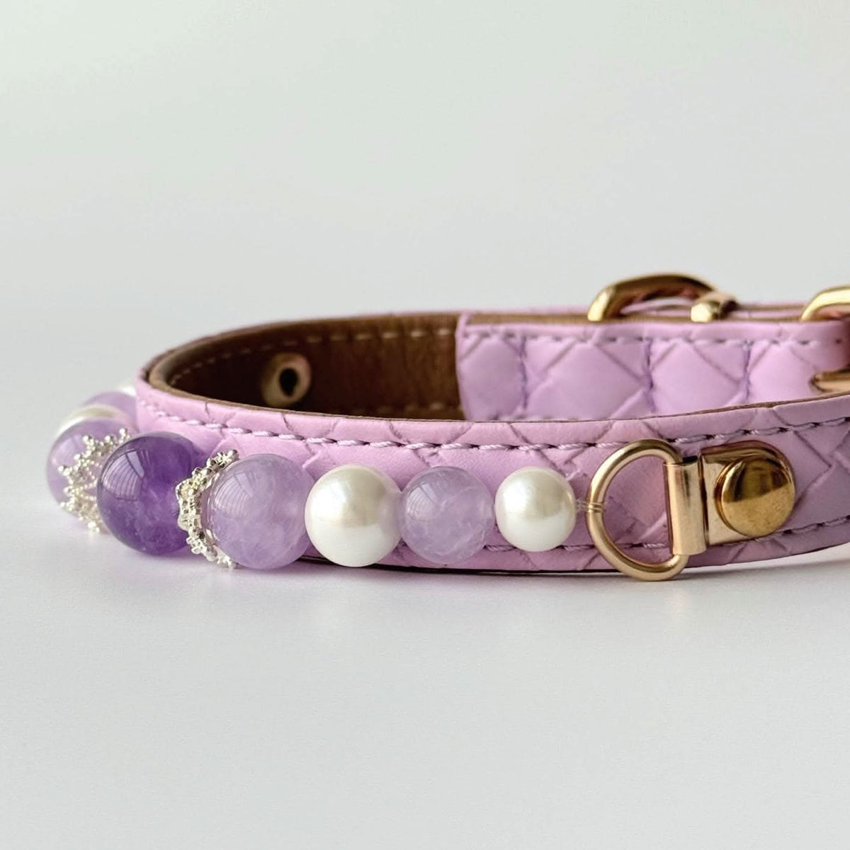 Side profile studio shot pink quilted pet collar with amethyst and pearl bead embellishments | DIY Jade