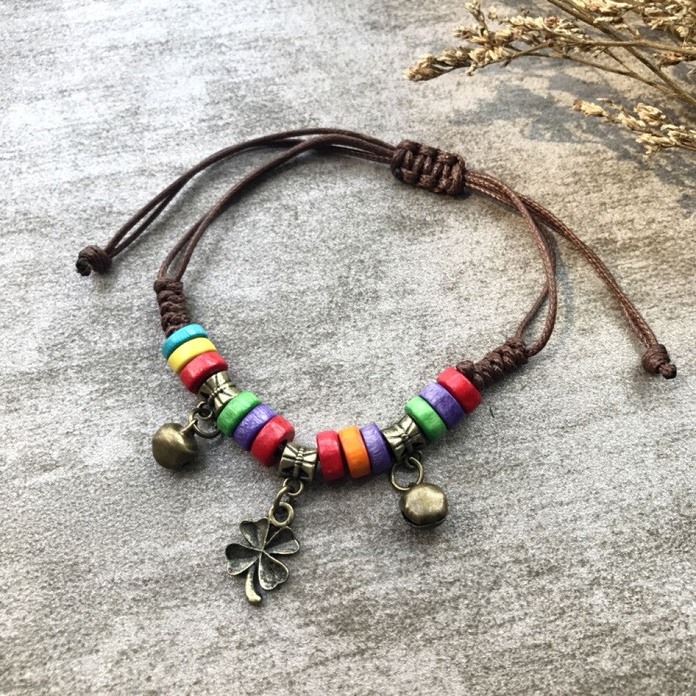 Boho rainbow bead bracelet with flower charm and bells | DIY Jade
