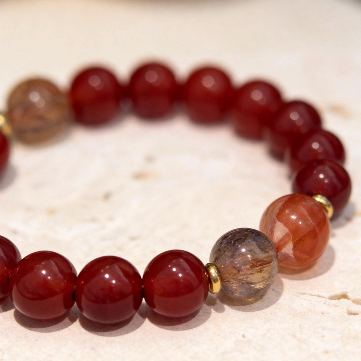 Red agate bracelet with mixed natural stone beads on neutral light background | DIY Jade