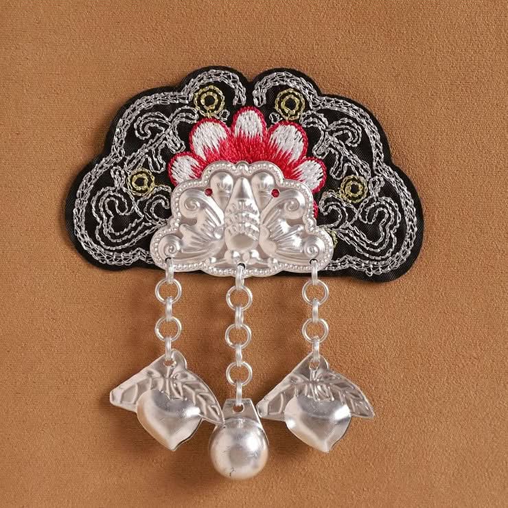 Red flower embroidery patch, chain‑linked silver pendants with bell‑style charm details