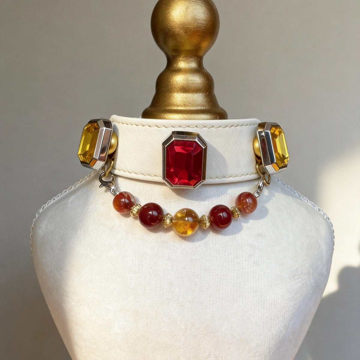 Side view of vintage red gemstone cat collar with amber bead strand details | DIYJade