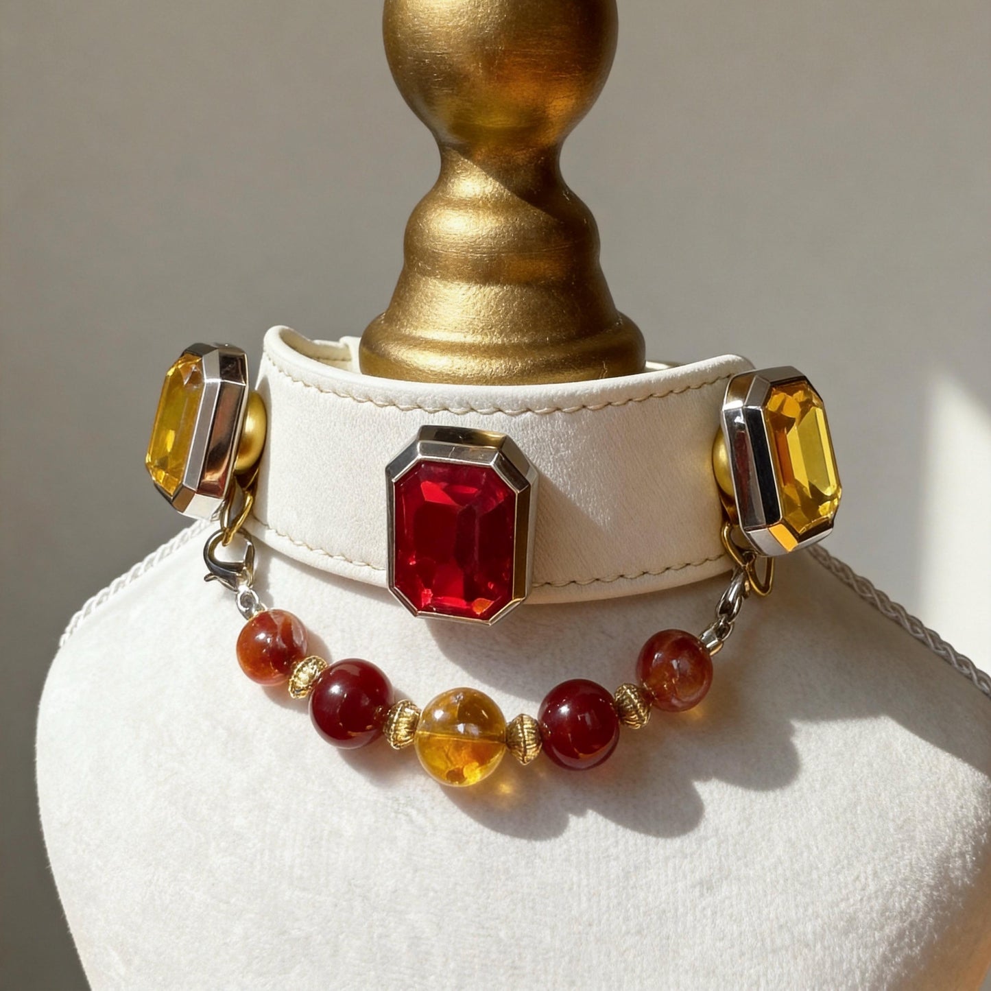 Multi-angle view of vintage cat collar with red centerpiece, amber beads, and gold-tone chain | DIYJade