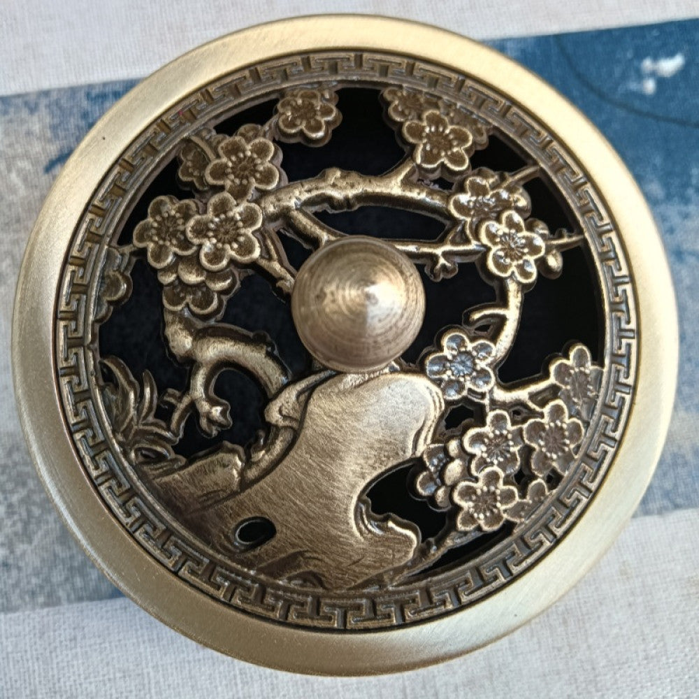Reddish-brown incense burner with dragon-themed carved lid, outdoor lifestyle shot | DIY Jade