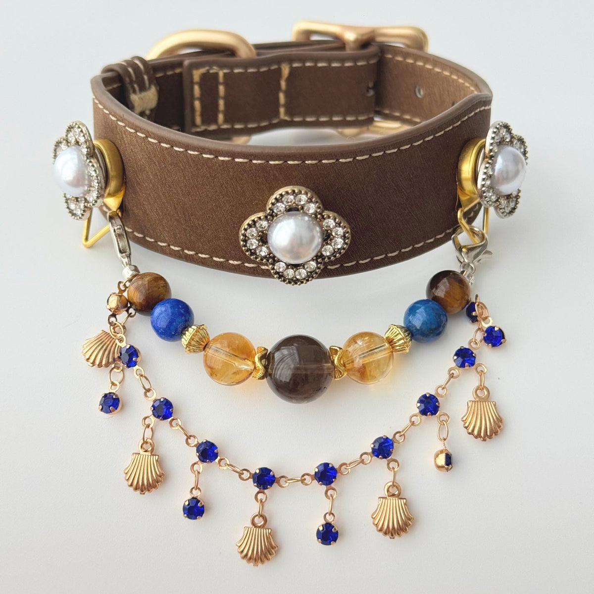 Flat lay shot of retro royal style dog collar, pearl rhinestone floral ornament and natural tiger eye citrine blue quartz beaded necklace | DIY Jade
