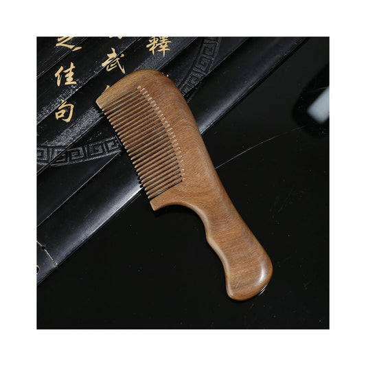 Green sandalwood comb handle texture detail