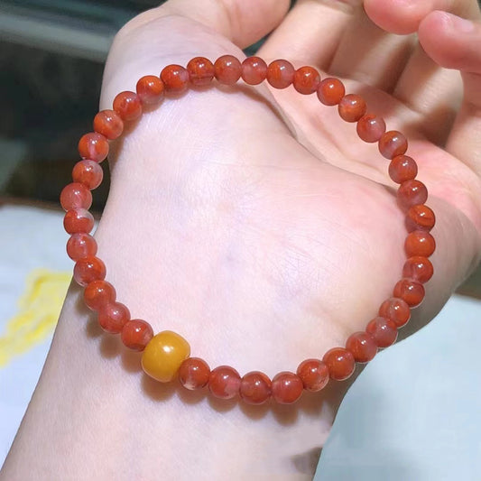 Single strand red agate bracelet with yellow amber accent bead | DIY Jade
