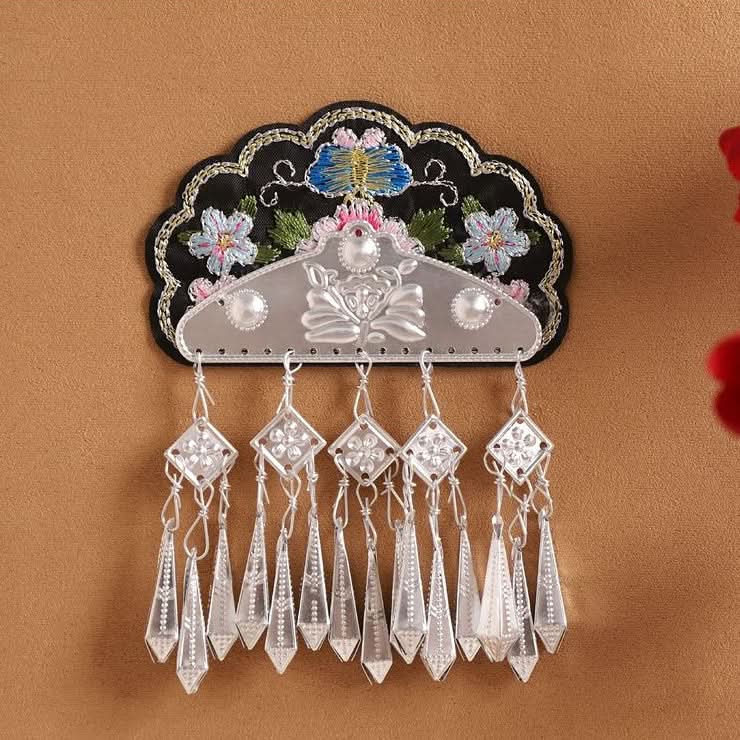 Symmetrical ethnic patch, floral embroidery with orderly long silver tassel groups