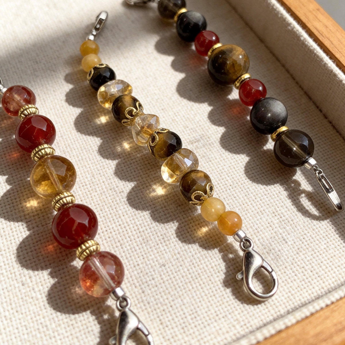 Closeup of handmade pet collar bead chains with tiger eye, red agate and citrine gemstones | DIY Jade