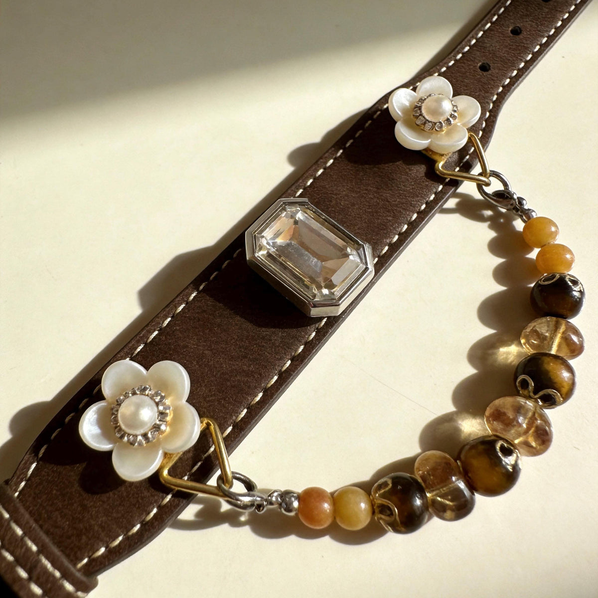 Top view brown leather pet collar decorated with white flowers and warm tone jade beads | DIY Jade