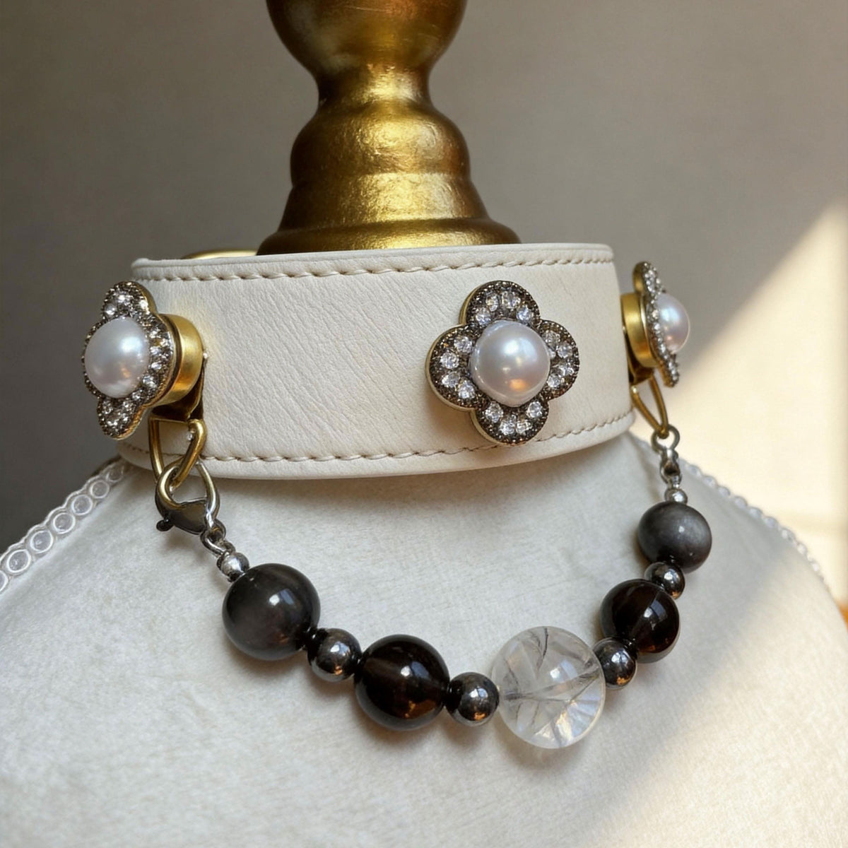 Angled view of ivory leather pet collar, clover pearl gem and smoky jade bead strand | DIY Jade
