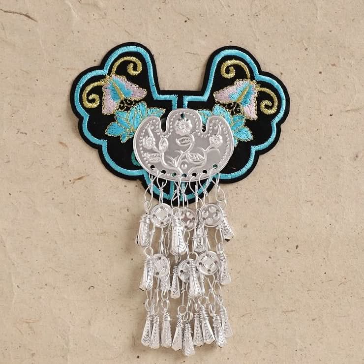 Turquoise embroidered tassel ornament