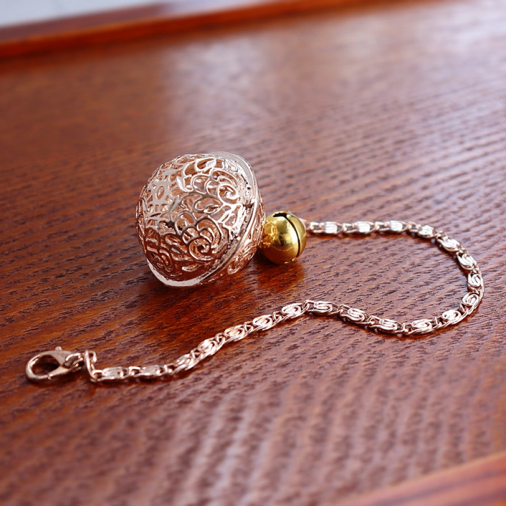 Openwork palace bell bracelet with warm accent beads on wooden background | DIY Jade