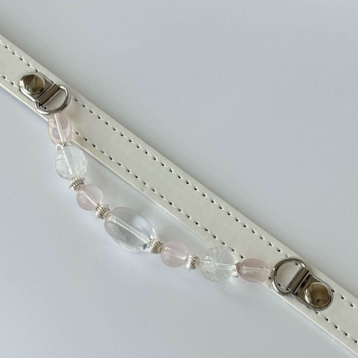 Closeup of detachable pale green crystal bead chain for white pet collar | DIY Jade
