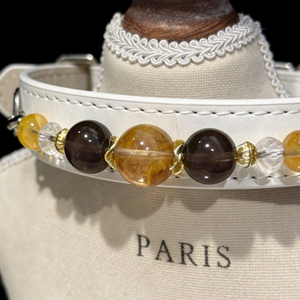 Close‑up studio view of white pet collar with brown and golden crystal beads | DIY Jade