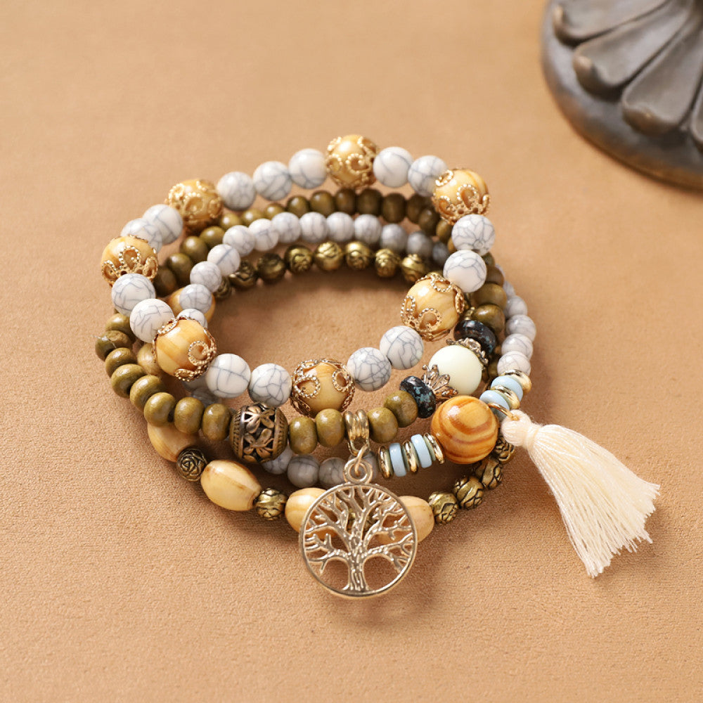 Natural wood bead bracelet with tree charm and tassel detail | DIY Jade
