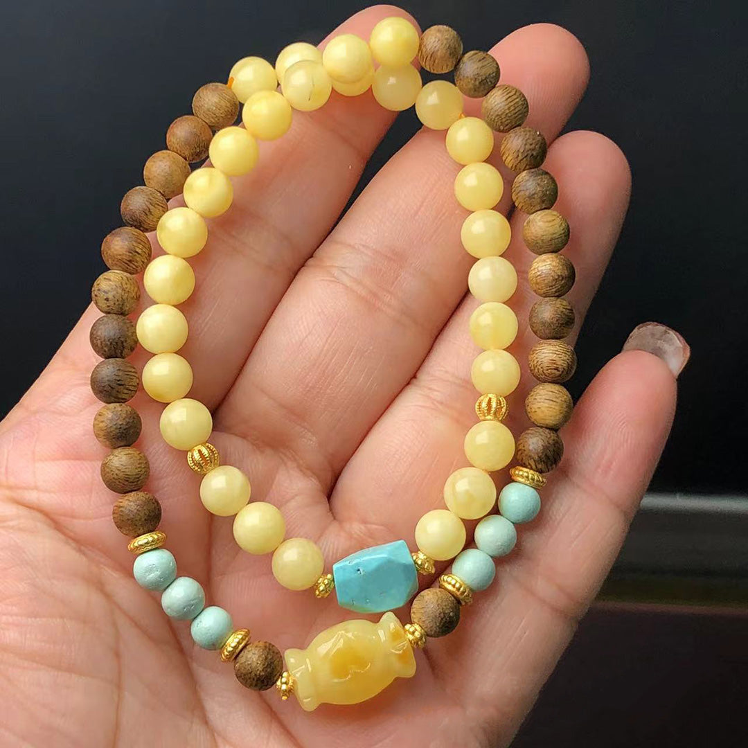 Yellow amber and wood double strand bracelet with turquoise and fish charm | DIY Jade